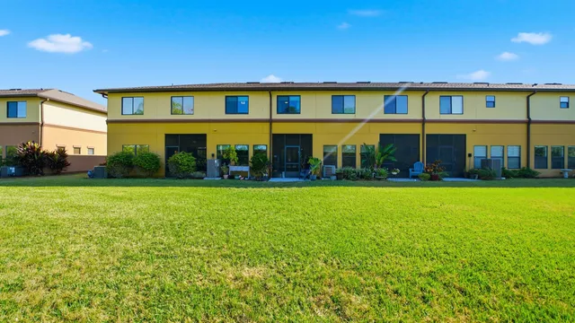 a front view of a building with garden
