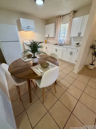 a view of kitchen with furniture and wooden floor