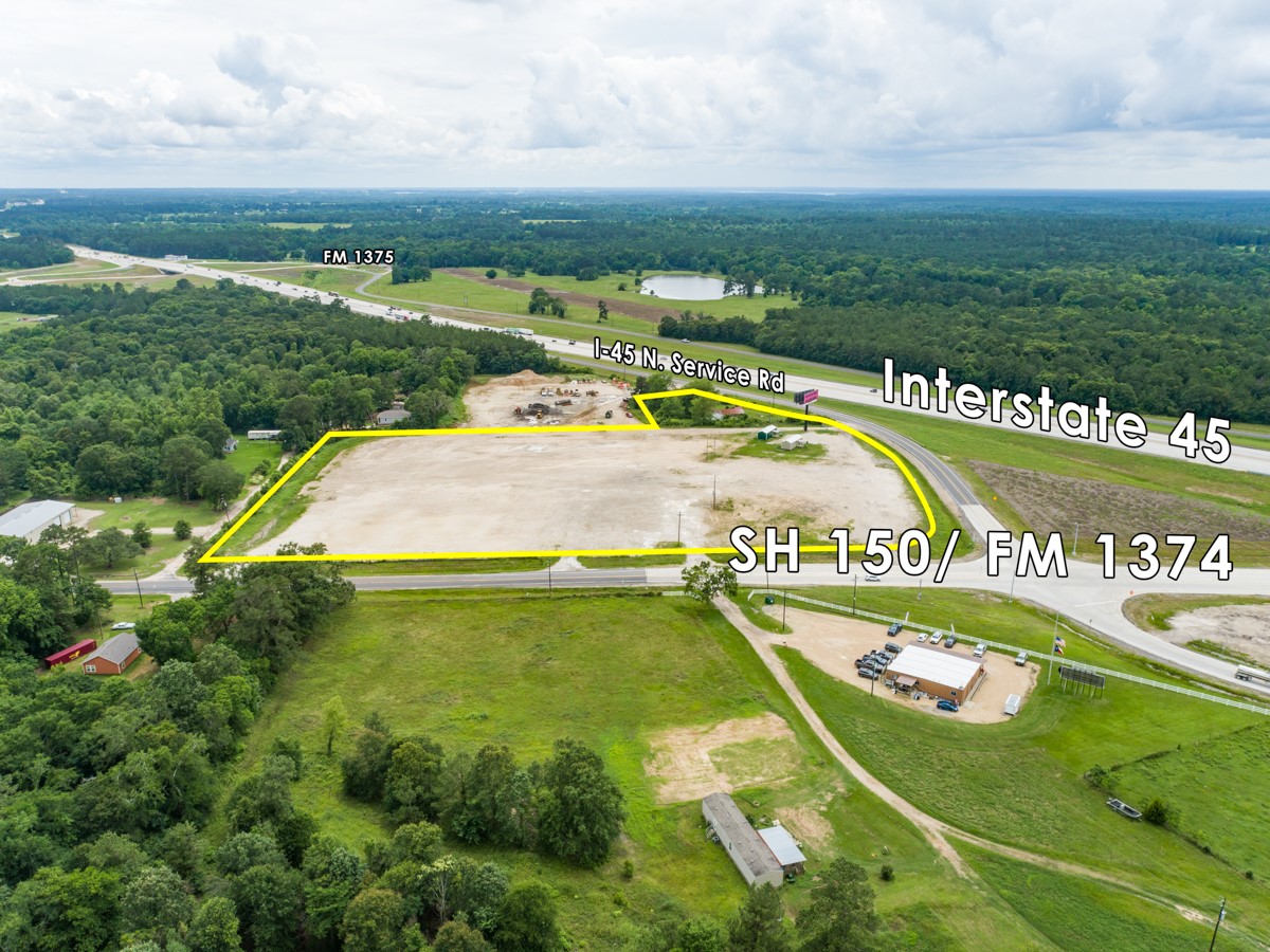 0 North I-45 N Service Road New Waverly, TX 77358 - Photo 2 of 11 a view of a swimming pool with a garden