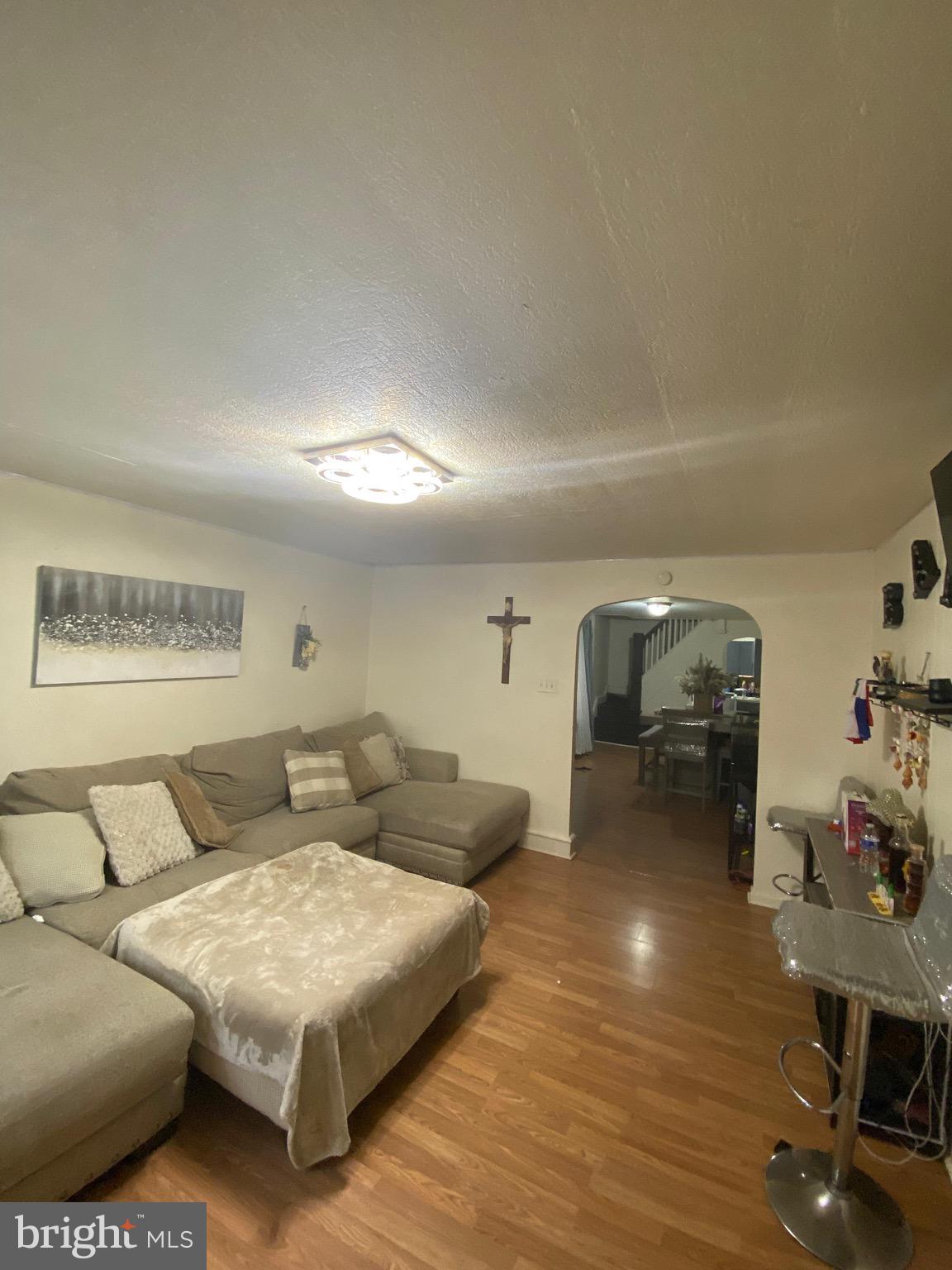 1047 Cotton Street Reading, PA 19602 - Photo 2 of 4 a living room with furniture and wooden floor