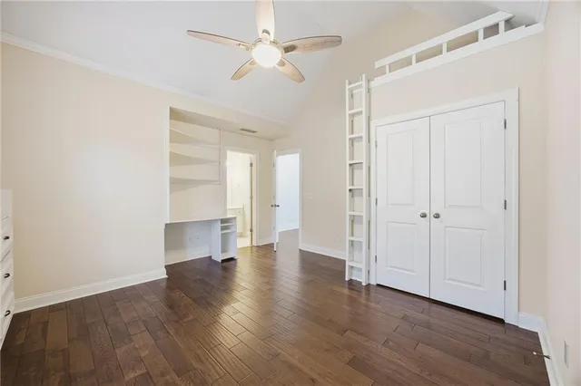 a bathroom with a toilet a sink a mirror a bathtub and vanity