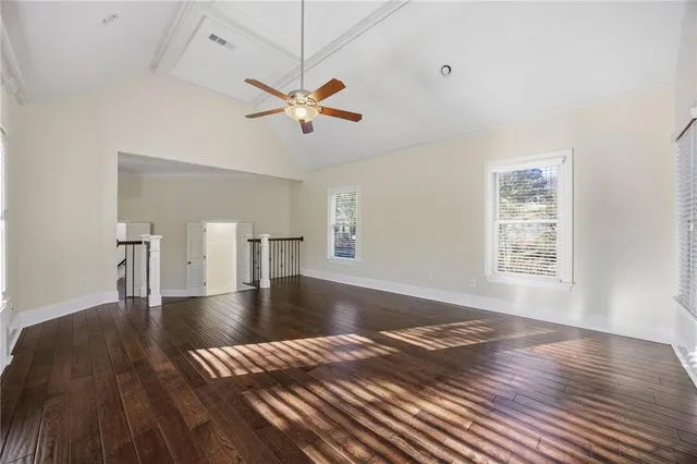 a view of an empty room and wooden floor