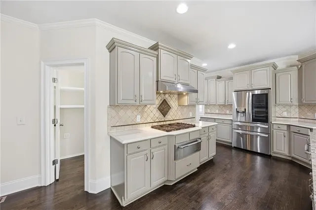 a view of an entryway with wooden floor