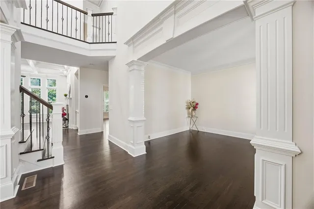 a view of staircase with white walls and windows