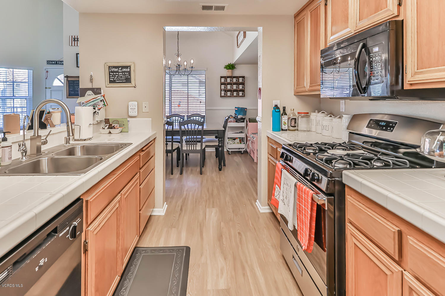 610 Geranium Lane, Unit A Simi Valley, CA 93065 - Photo 14 of 26 a kitchen with stainless steel appliances granite countertop a stove a sink dishwasher and cabinets with wooden floor