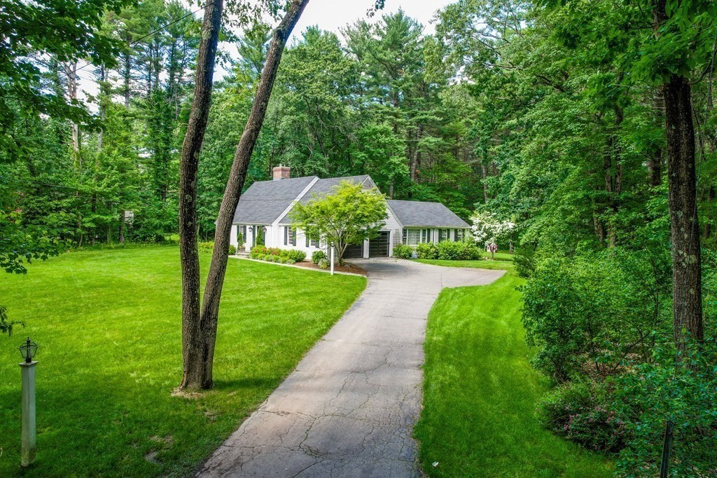49 Sears Road Wayland, MA 01778 - Photo 1 of 30 a front view of a house with a yard