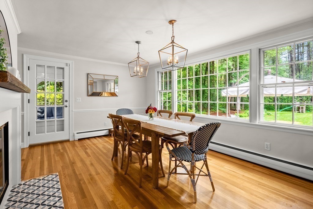 49 Sears Road Wayland, MA 01778 - Photo 12 of 30 a view of a dining room with furniture window and wooden floor