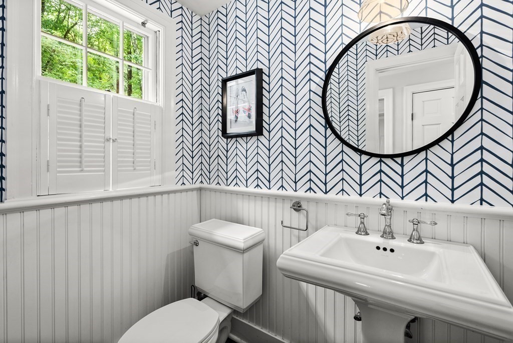 49 Sears Road Wayland, MA 01778 - Photo 13 of 30 a bathroom with a sink a mirror and a toilet
