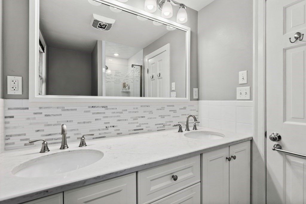 49 Sears Road Wayland, MA 01778 - Photo 17 of 30 a bathroom with a sink and a mirror