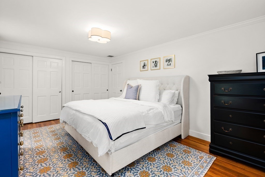 49 Sears Road Wayland, MA 01778 - Photo 18 of 30 a bedroom with a bed and a cabinets
