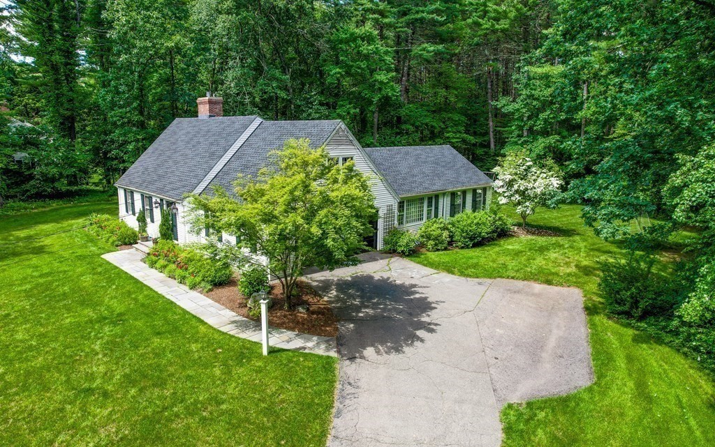 49 Sears Road Wayland, MA 01778 - Photo 2 of 30 a aerial view of a house with a yard and large trees