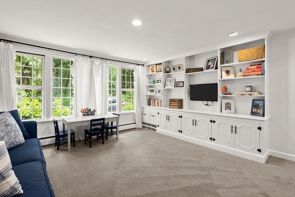 49 Sears Road Wayland, MA 01778 - Photo 21 of 30 a living room with furniture and flat screen tv