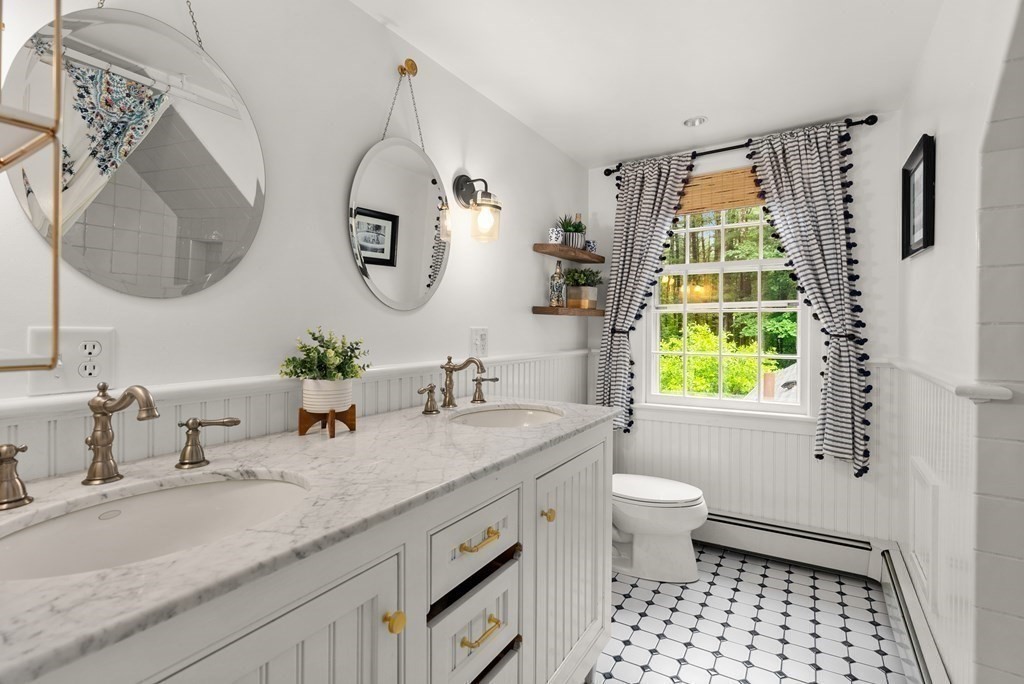49 Sears Road Wayland, MA 01778 - Photo 23 of 30 a bathroom with a granite countertop sink mirror and toilet