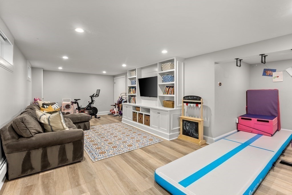 49 Sears Road Wayland, MA 01778 - Photo 26 of 30 a living room with furniture and a flat screen tv