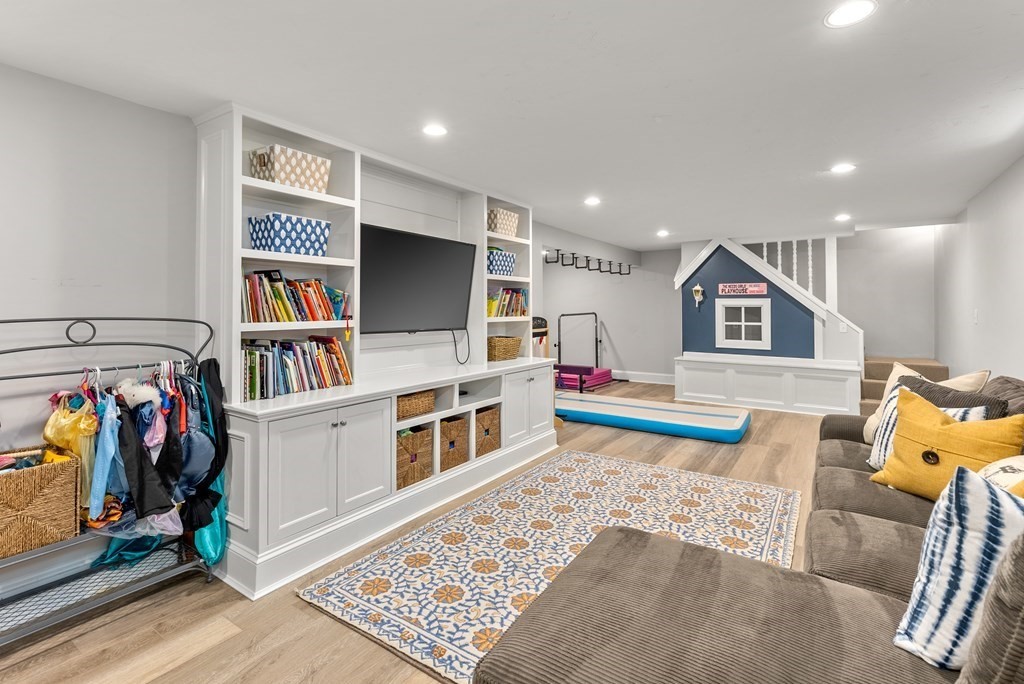49 Sears Road Wayland, MA 01778 - Photo 27 of 30 a living room with furniture and a flat screen tv