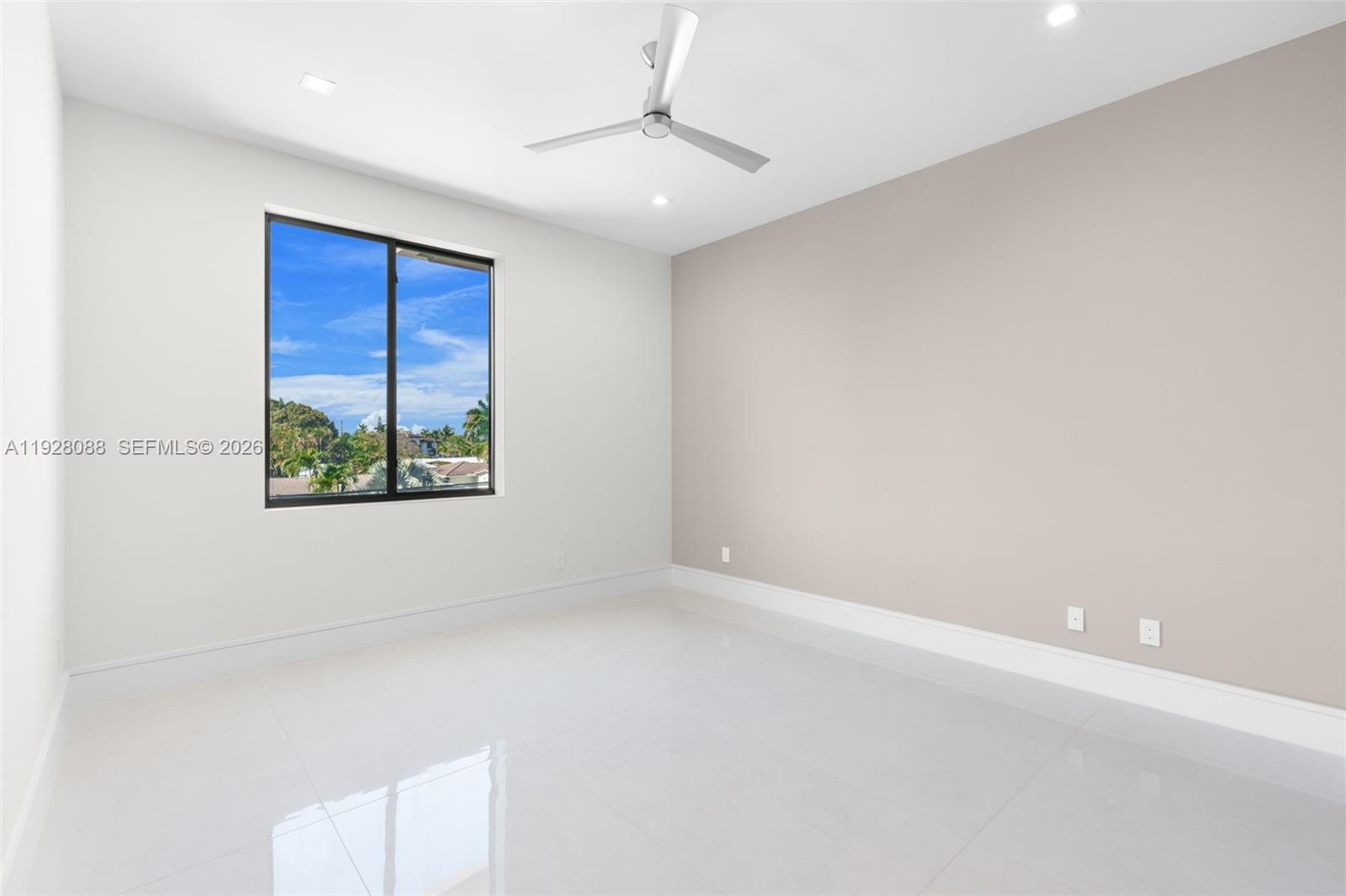 4910 Northeast 27th Avenue Lighthouse Point, FL 33064 - Photo 47 of 68 an empty room with windows