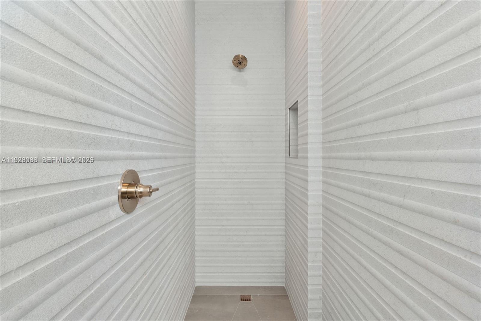 4910 Northeast 27th Avenue Lighthouse Point, FL 33064 - Photo 51 of 68 a bathroom with a shower