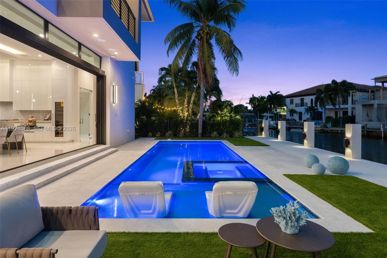 4910 Northeast 27th Avenue Lighthouse Point, FL 33064 - Photo 66 of 68 a view of swimming pool with outdoor seating