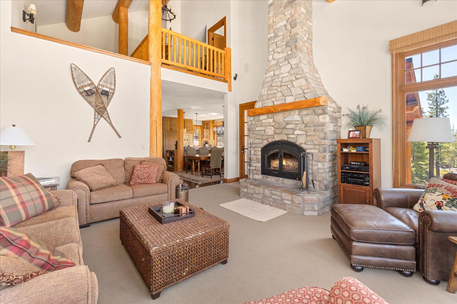 110 Flynn Road Bear Valley, CA 95223 - Photo 12 of 56 a living room with furniture and a fireplace