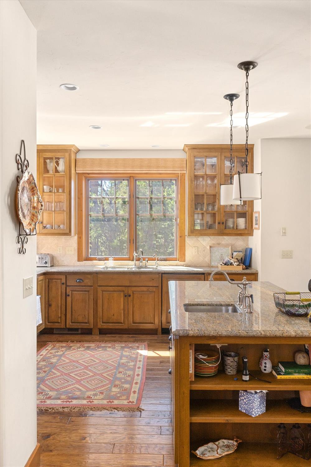 110 Flynn Road Bear Valley, CA 95223 - Photo 15 of 56 a large kitchen with stainless steel appliances granite countertop a stove and a wooden cabinets
