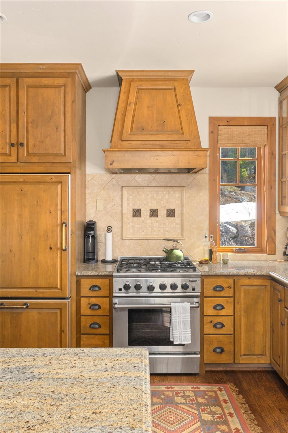 110 Flynn Road Bear Valley, CA 95223 - Photo 17 of 56 a kitchen with stainless steel appliances granite countertop a stove and a refrigerator
