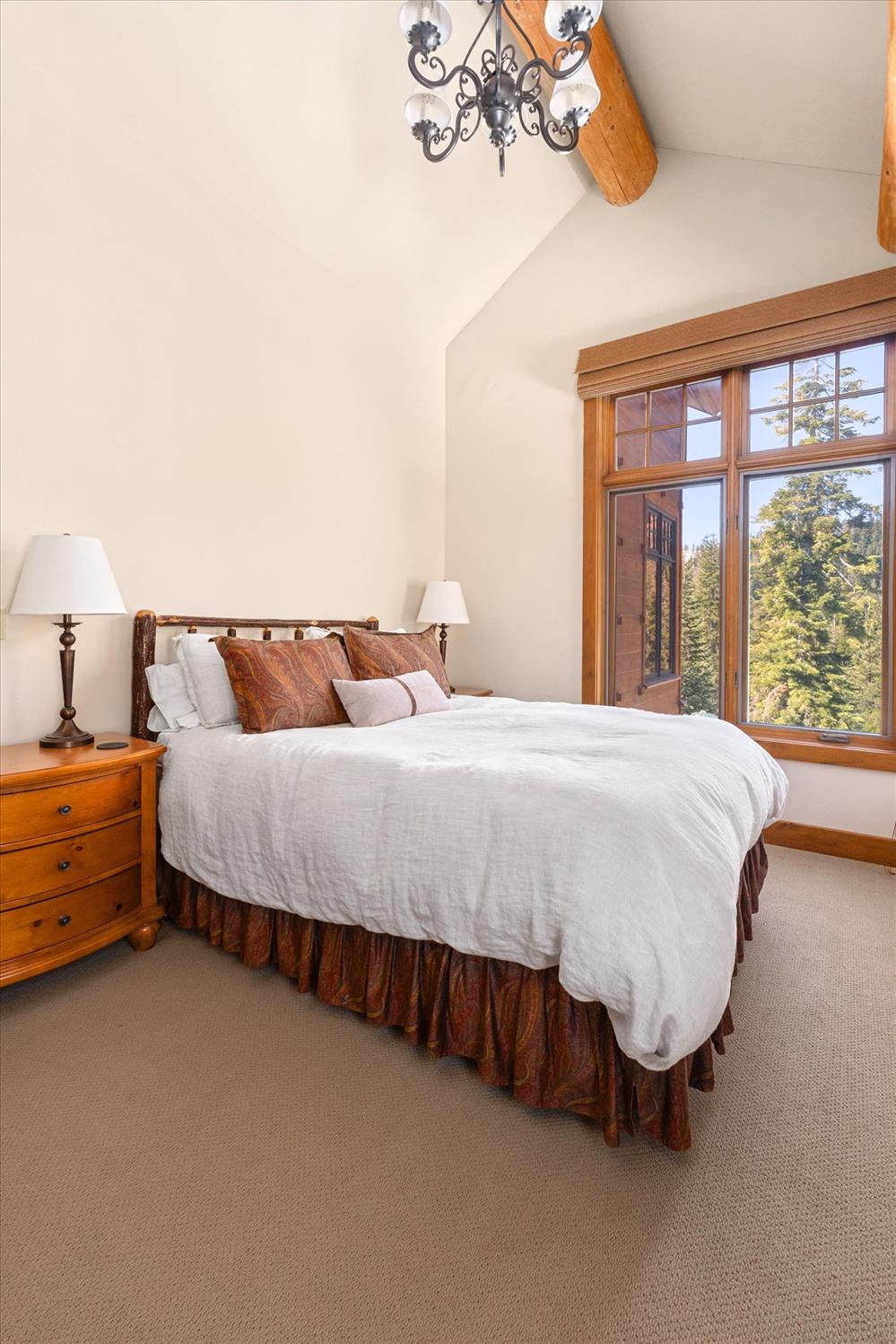 110 Flynn Road Bear Valley, CA 95223 - Photo 19 of 56 a bed sitting in a bedroom next to a window