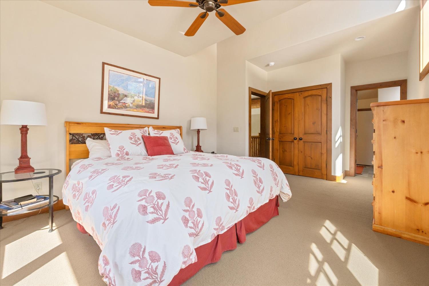 110 Flynn Road Bear Valley, CA 95223 - Photo 24 of 56 a bedroom with a bed and a chandelier