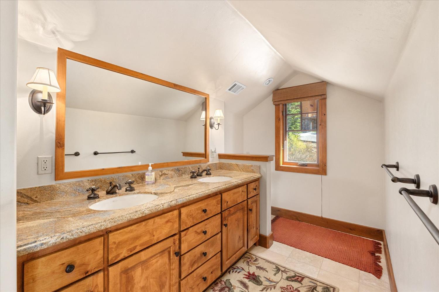 110 Flynn Road Bear Valley, CA 95223 - Photo 26 of 56 a bathroom with a granite countertop sink and a mirror