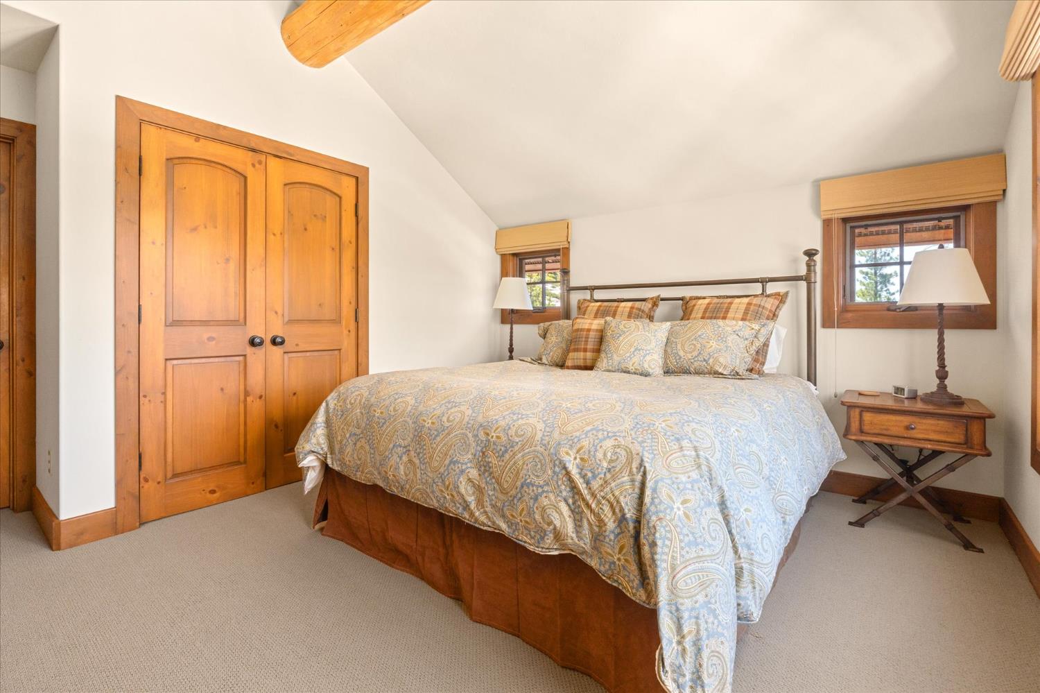 110 Flynn Road Bear Valley, CA 95223 - Photo 30 of 56 a spacious bedroom with a bed and a window