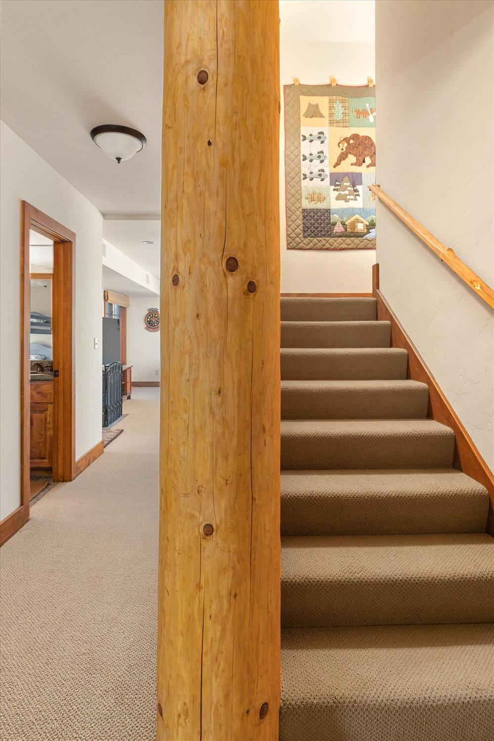 110 Flynn Road Bear Valley, CA 95223 - Photo 31 of 56 a view of a hallway with wooden floor and staircase