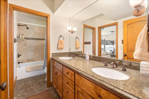 a view of a two chairs in the balcony