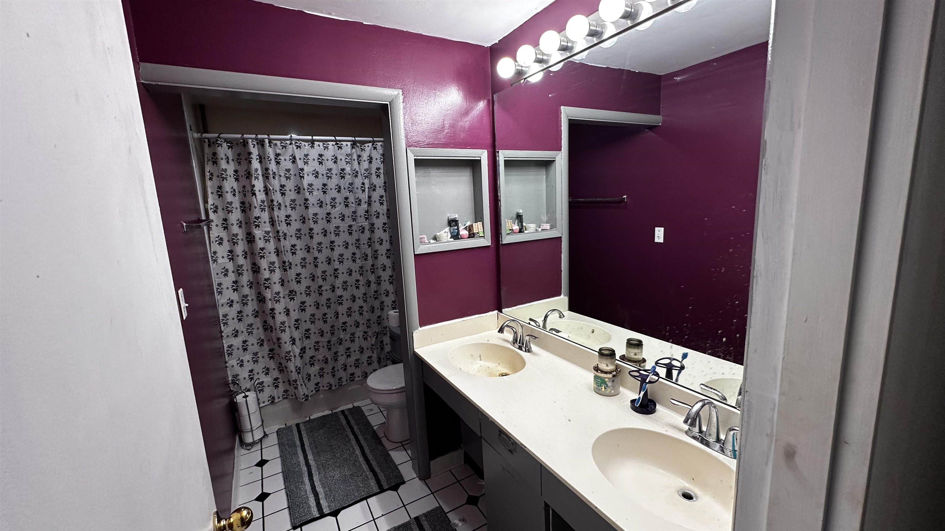 4721 Highcrest Road Rockford, IL 61107 - Photo 14 of 22 a bathroom with a sink and a mirror