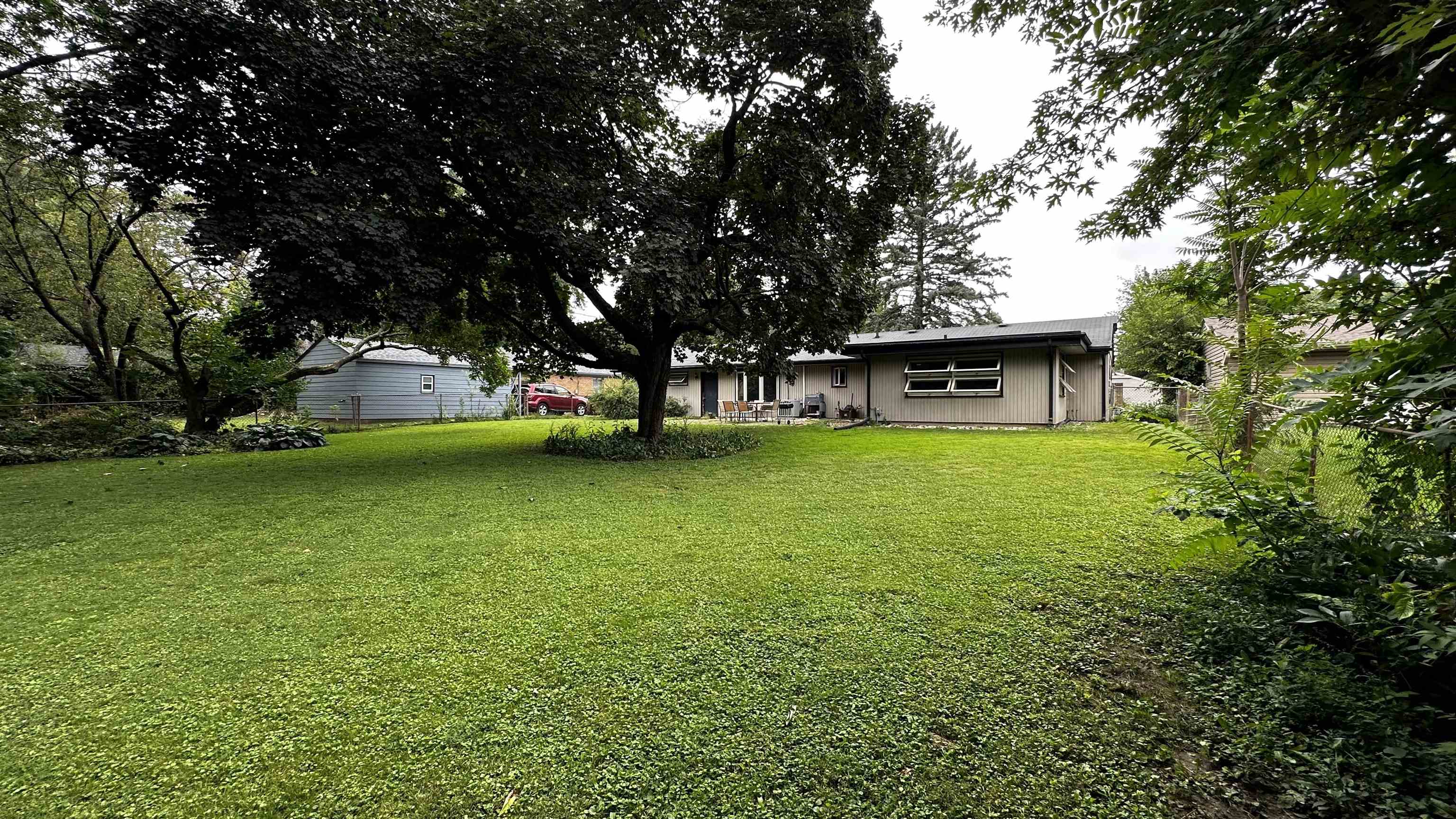 4721 Highcrest Road Rockford, IL 61107 - Photo 20 of 22 a view of a house with a yard
