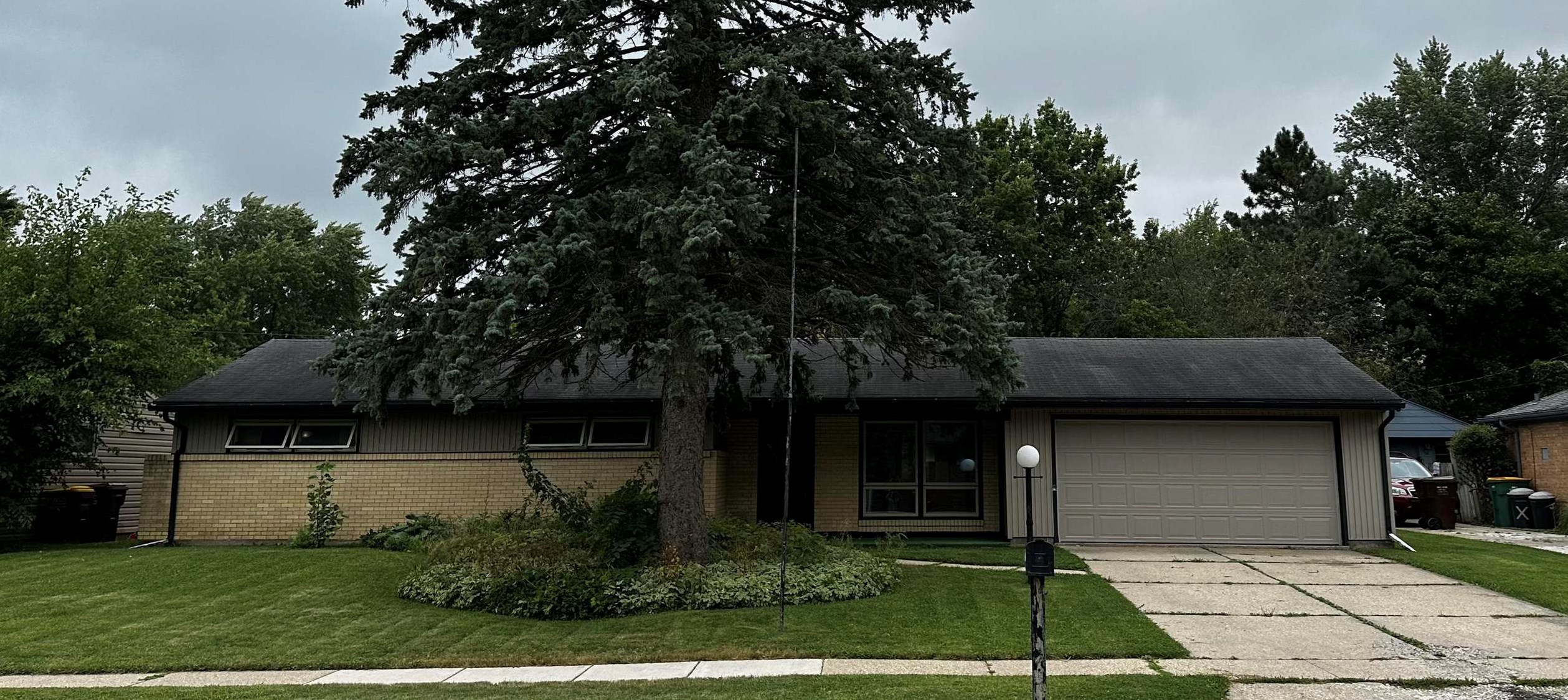 4721 Highcrest Road Rockford, IL 61107 - Photo 2 of 22 a front view of house with yard