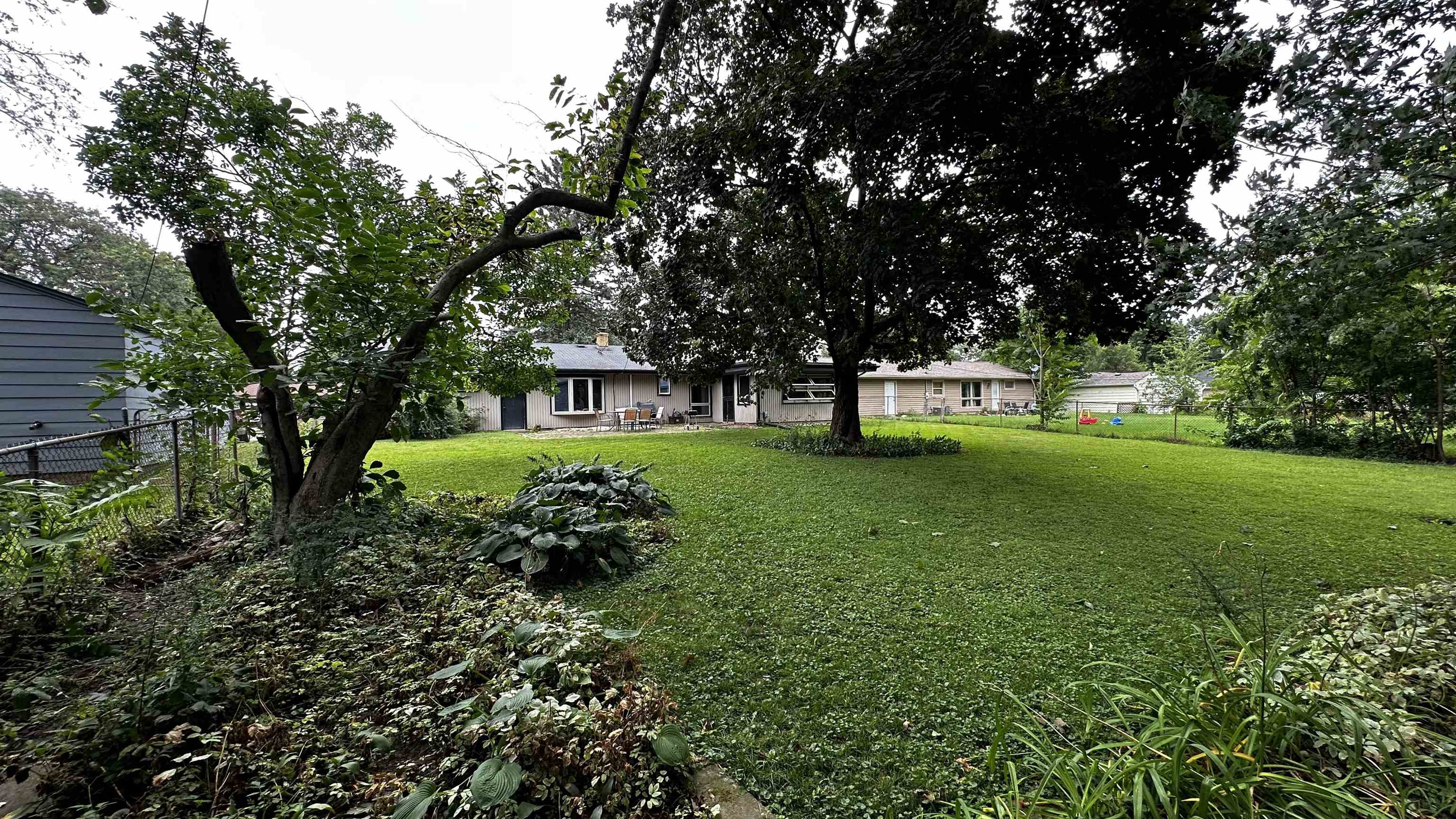 4721 Highcrest Road Rockford, IL 61107 - Photo 22 of 22 a view of a house with a back yard