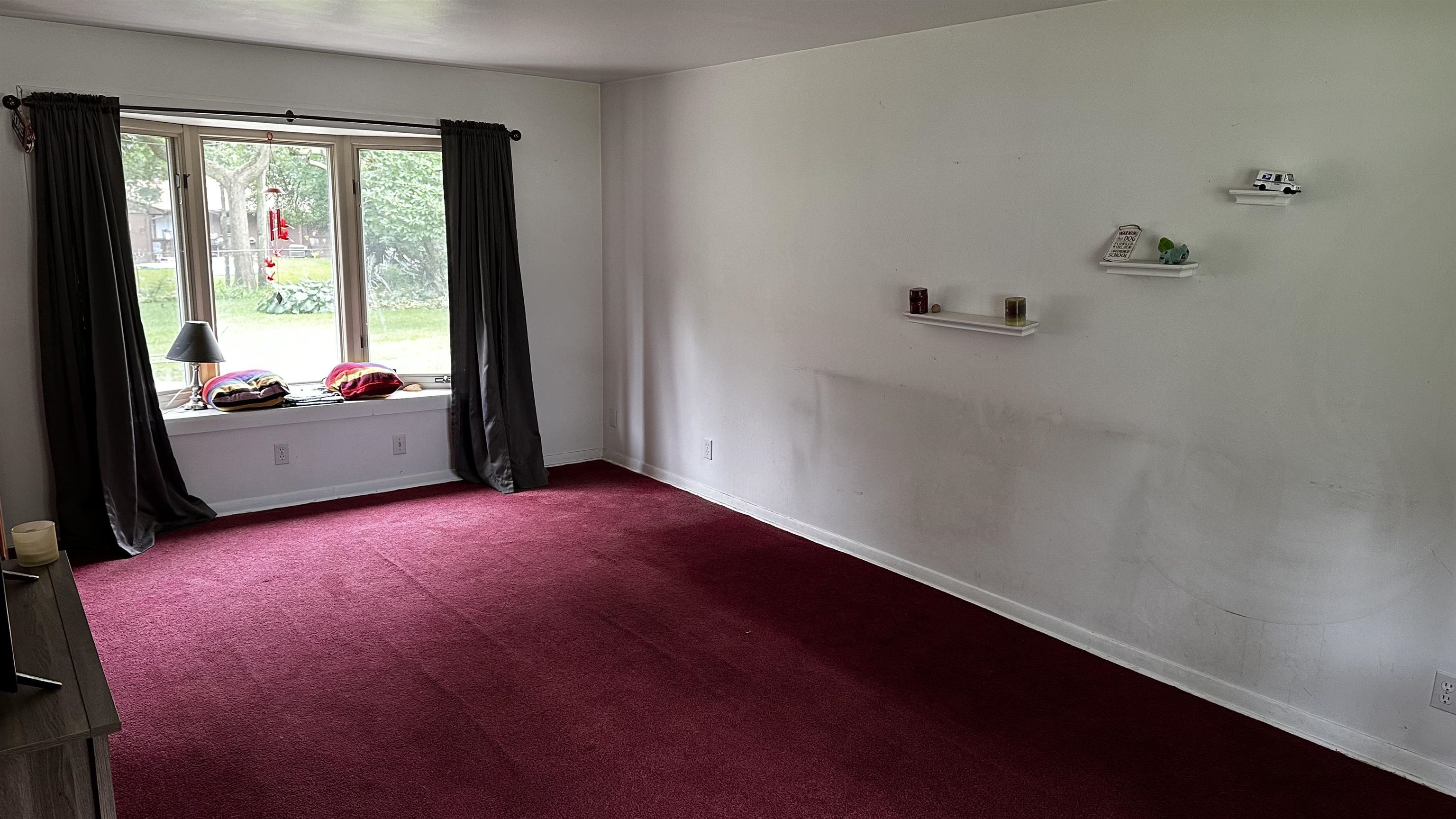 4721 Highcrest Road Rockford, IL 61107 - Photo 4 of 22 a view of an empty room with a window