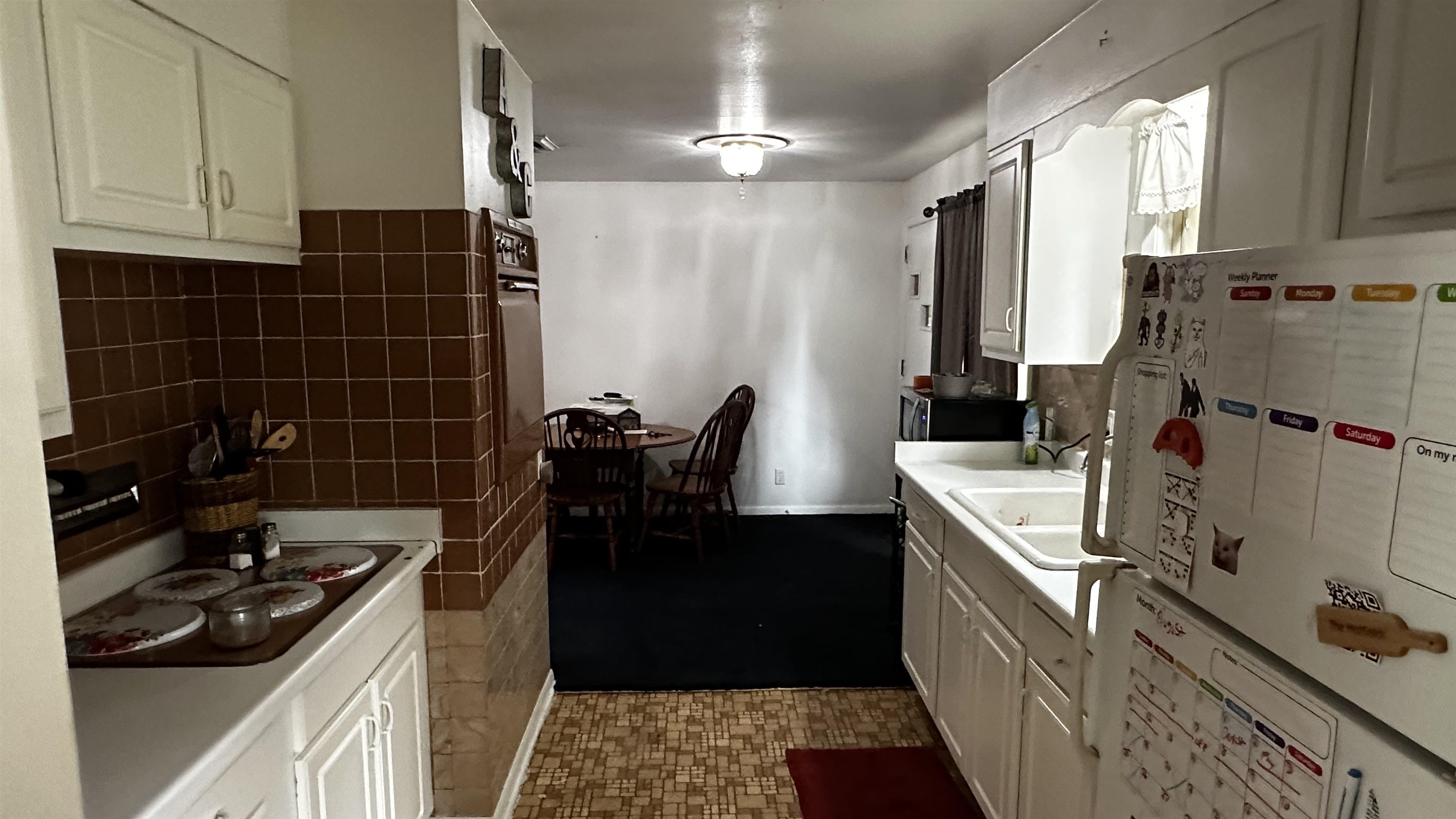 4721 Highcrest Road Rockford, IL 61107 - Photo 7 of 22 a kitchen with a sink stove and refrigerator