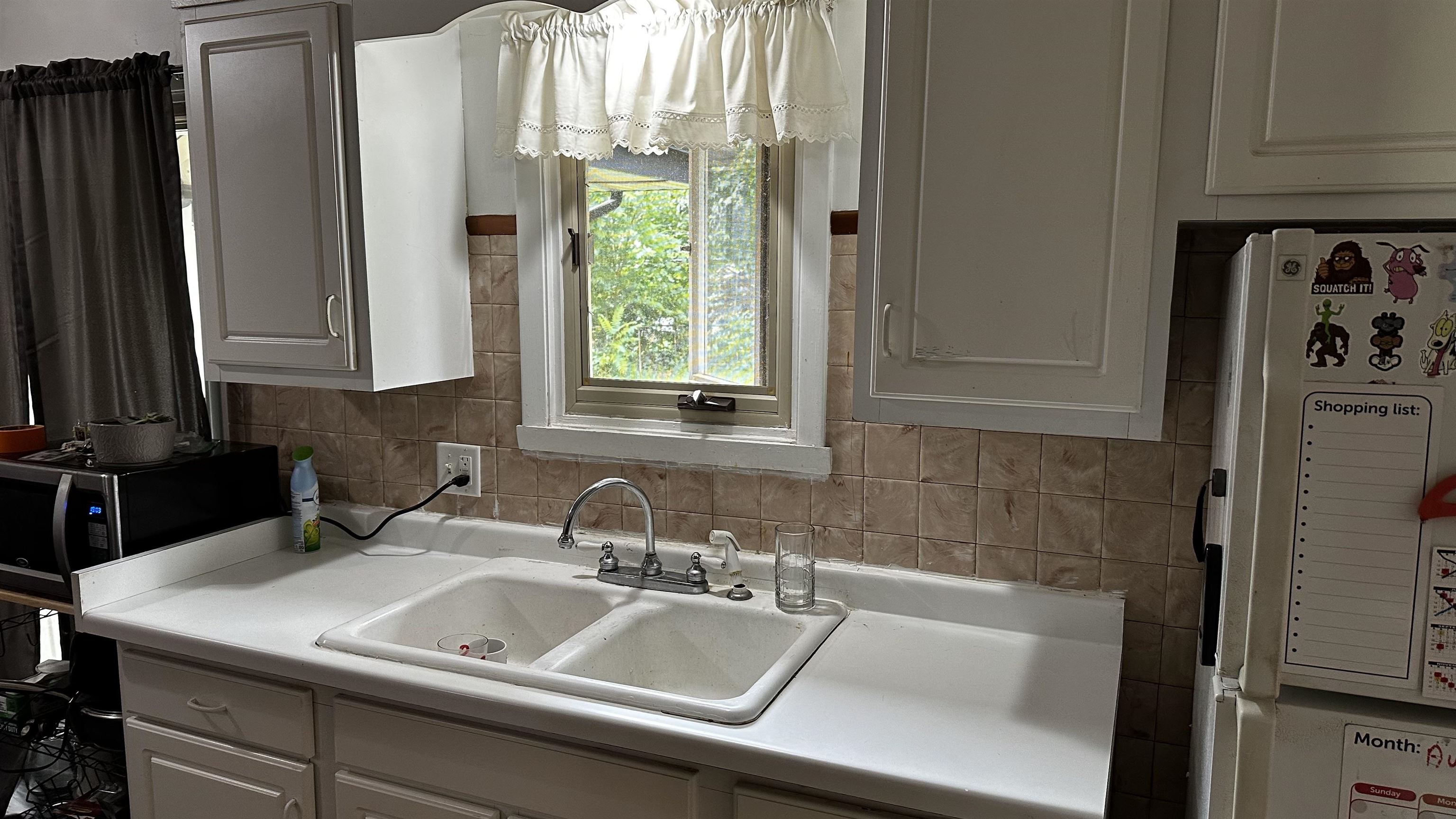 4721 Highcrest Road Rockford, IL 61107 - Photo 10 of 22 a bathroom with a sink and a mirror