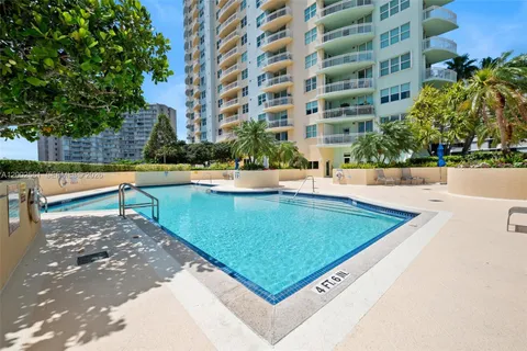 a view of a swimming pool with a lounge chairs