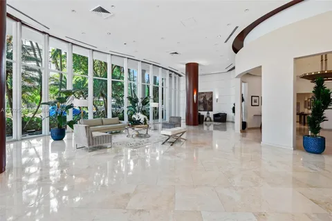 a view of a entryway with furniture and floor to ceiling window