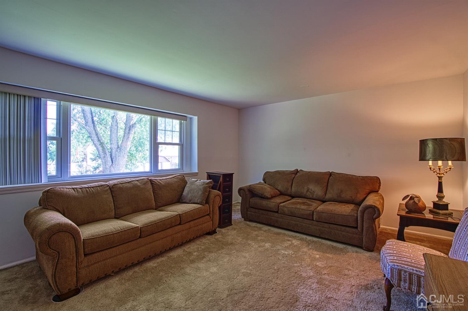 29 Surrey Road Somerset, NJ 08873 - Photo 11 of 18 a living room with furniture and a large window
