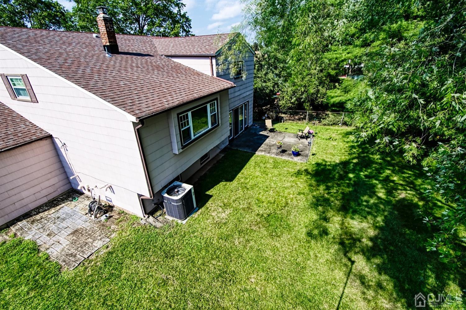 29 Surrey Road Somerset, NJ 08873 - Photo 4 of 18 a view of a backyard with chairs