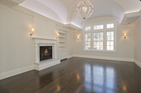 1 Green Lane Weston, MA 02493 - Photo 17 of 30 an empty room with wooden floor fireplace and windows