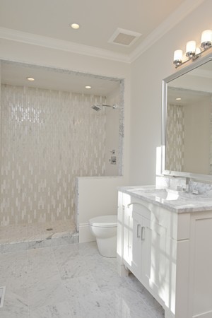 1 Green Lane Weston, MA 02493 - Photo 22 of 30 a bathroom with a granite countertop sink a toilet and a mirror