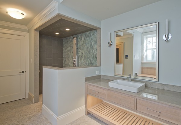 1 Green Lane Weston, MA 02493 - Photo 29 of 30 a bathroom with a sink a mirror and a shower