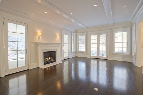 1 Green Lane Weston, MA 02493 - Photo 6 of 30 a view of an empty room with wooden floor and a window