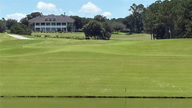 a view of an ocean house a yard and lake view