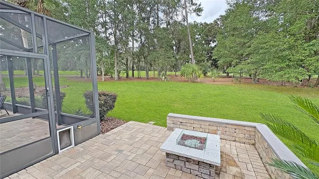 a view of a backyard with sitting area