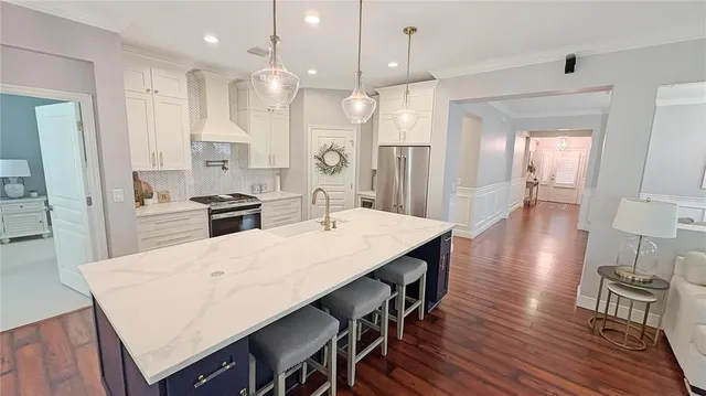 a large kitchen with a table and chairs