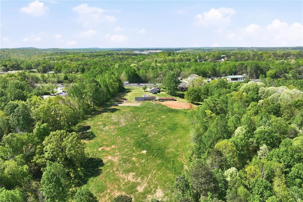 2475 Athens Highway Gainesville, GA 30507 - Photo 12 of 18 a view of a garden with an buildings in a yard